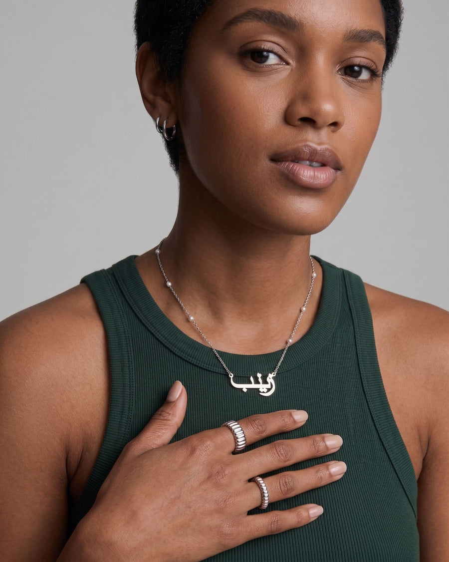 Model Image - personalized Heritage Name Necklace with a script pendant and pearl satellite chain detail worn on model