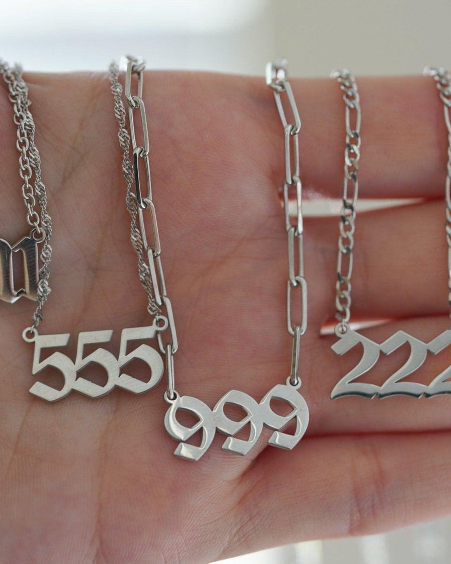 Model Image - silver finish angel number necklaces with inscribed number pendants shown on the model worn on model
