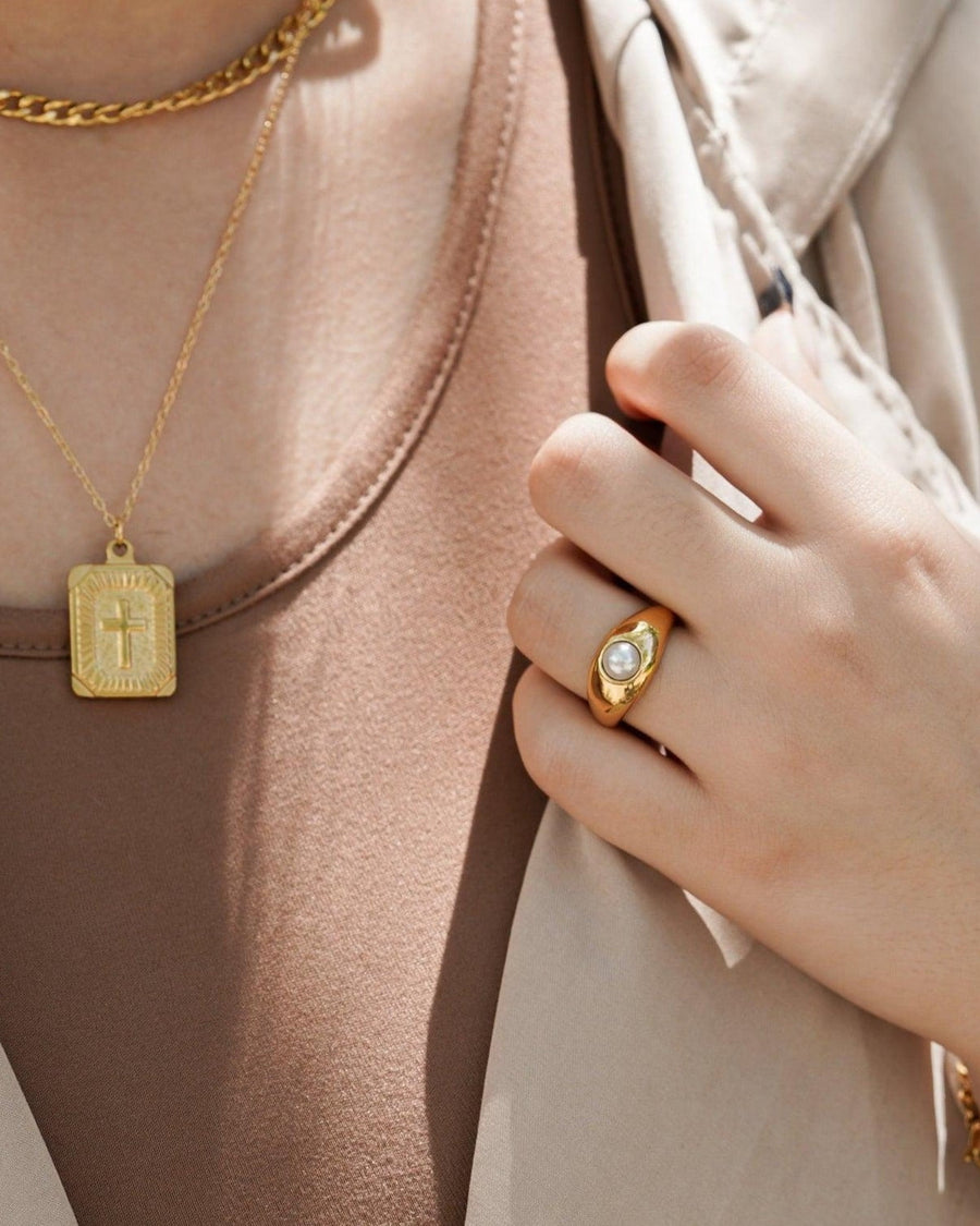 Style Image - Pearl ring worn on hand with layered necklaces for a styled jewelry look