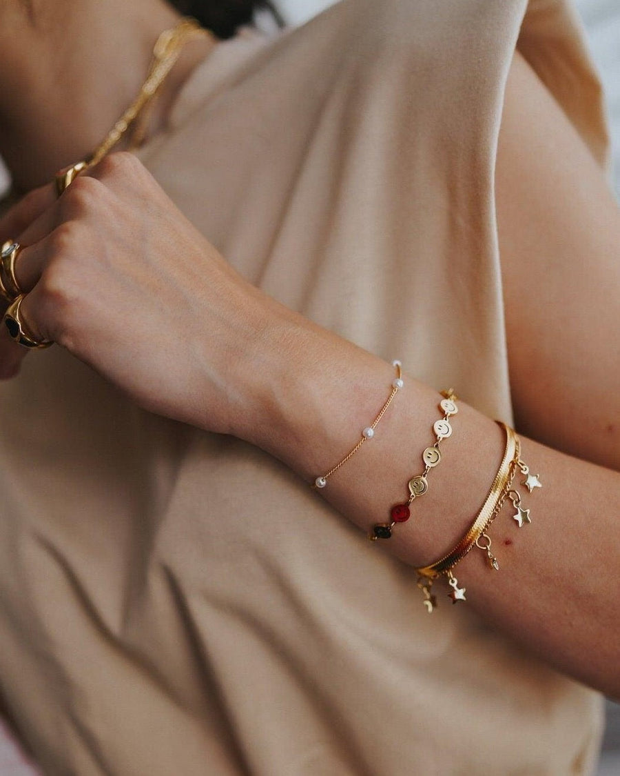 Style Image - Herringbone Bracelet worn stacked with assorted bracelets on the wrist