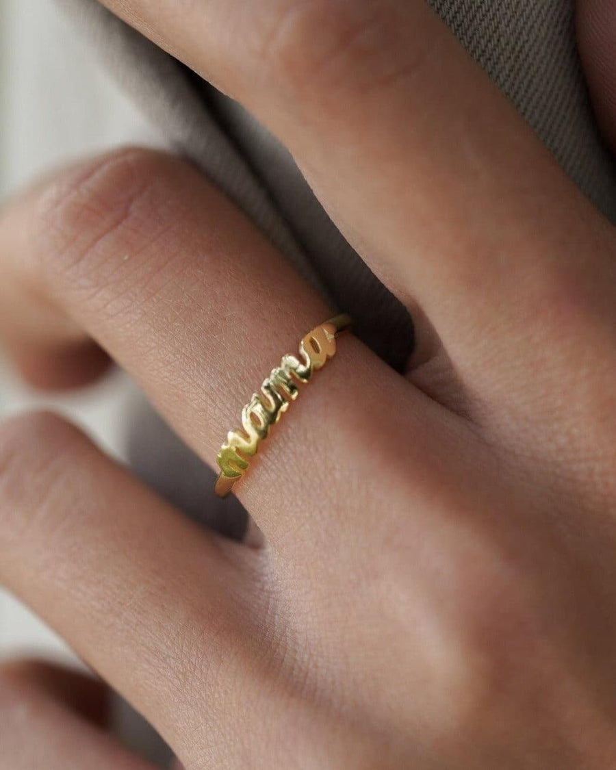 Style Image - Mama ring in 14K gold plated design worn on the hand, showing the scripted word detail