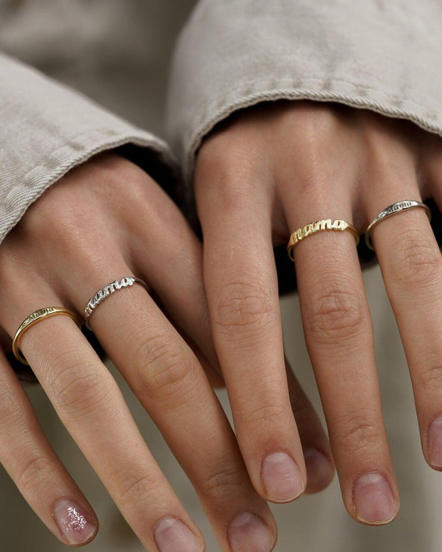 Style Image - Mama Ring shown worn on both hands with silver and gold-plated options stacked with slim rings