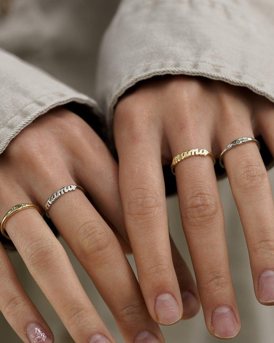 Style Image - Mama ring in 14K gold plated lettering worn with other rings on both hands