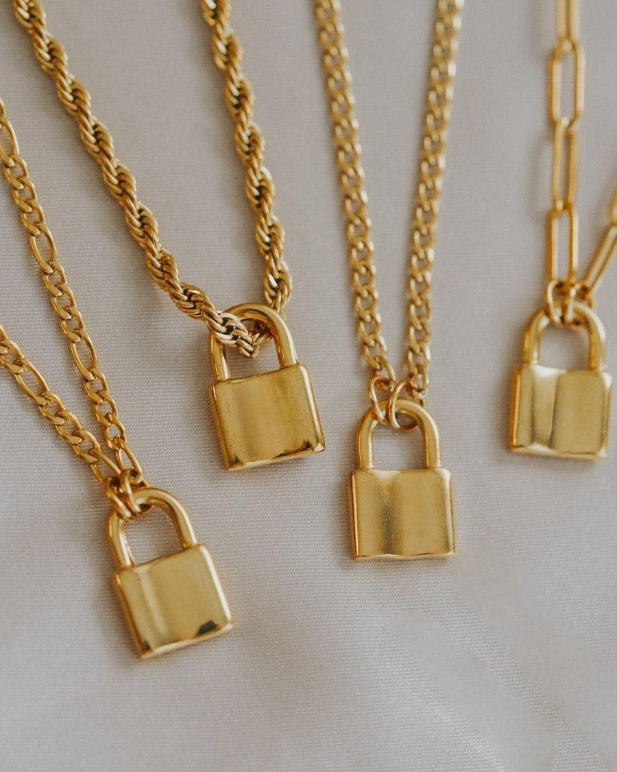 Model Image - gold plated stainless steel padlock necklace shown at the neckline with a chain and padlock pendant worn on model