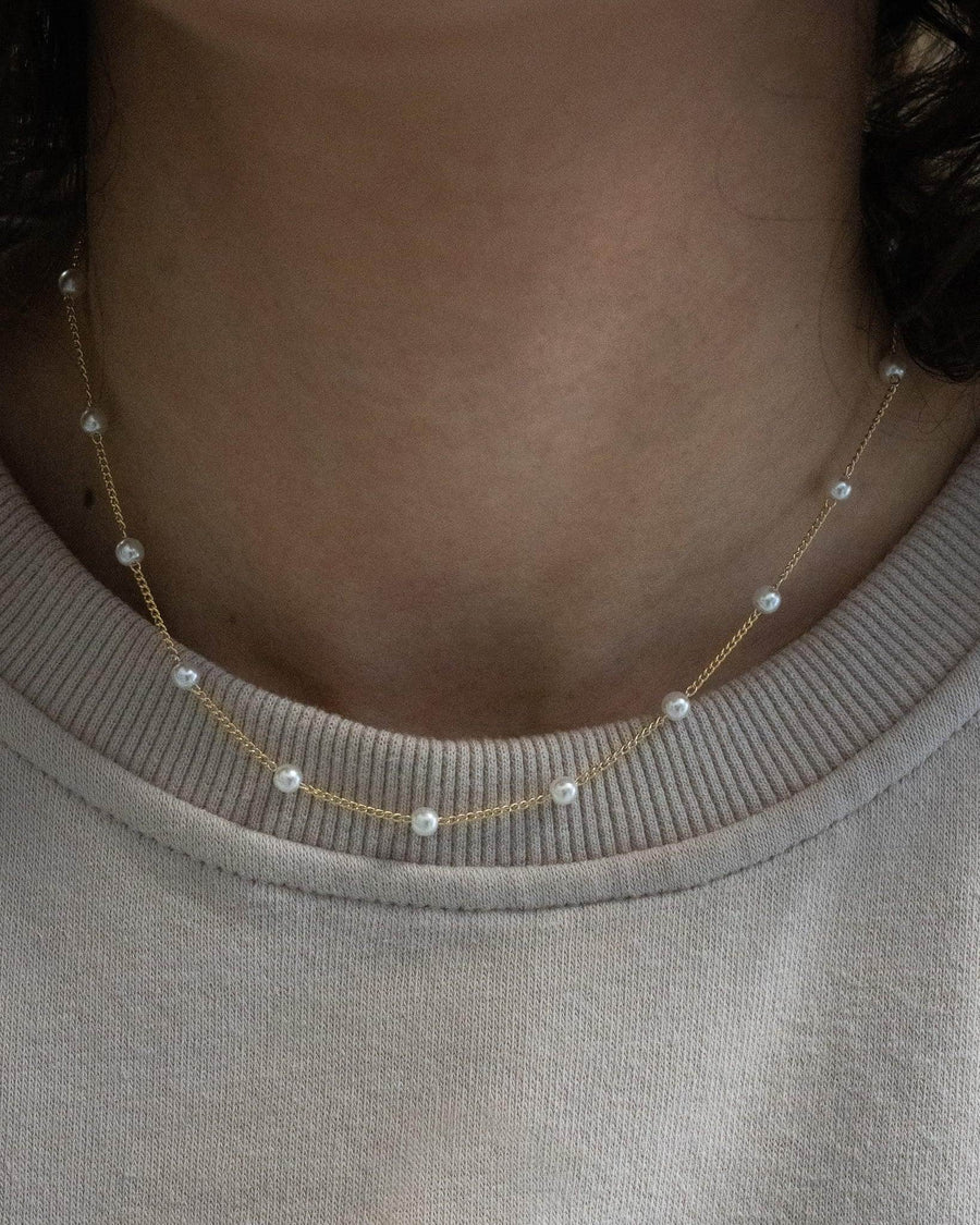Model Image - Satellite pearl chain necklace with delicate beaded pearls along a fine 18k gold plated chain worn on model