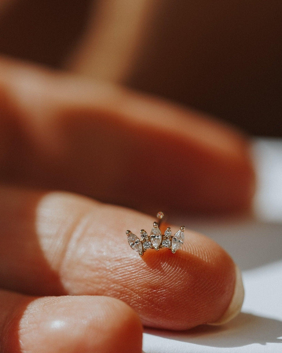 Detail Image - Marquise Tiara Stud earring with white zircon stones held between fingertips