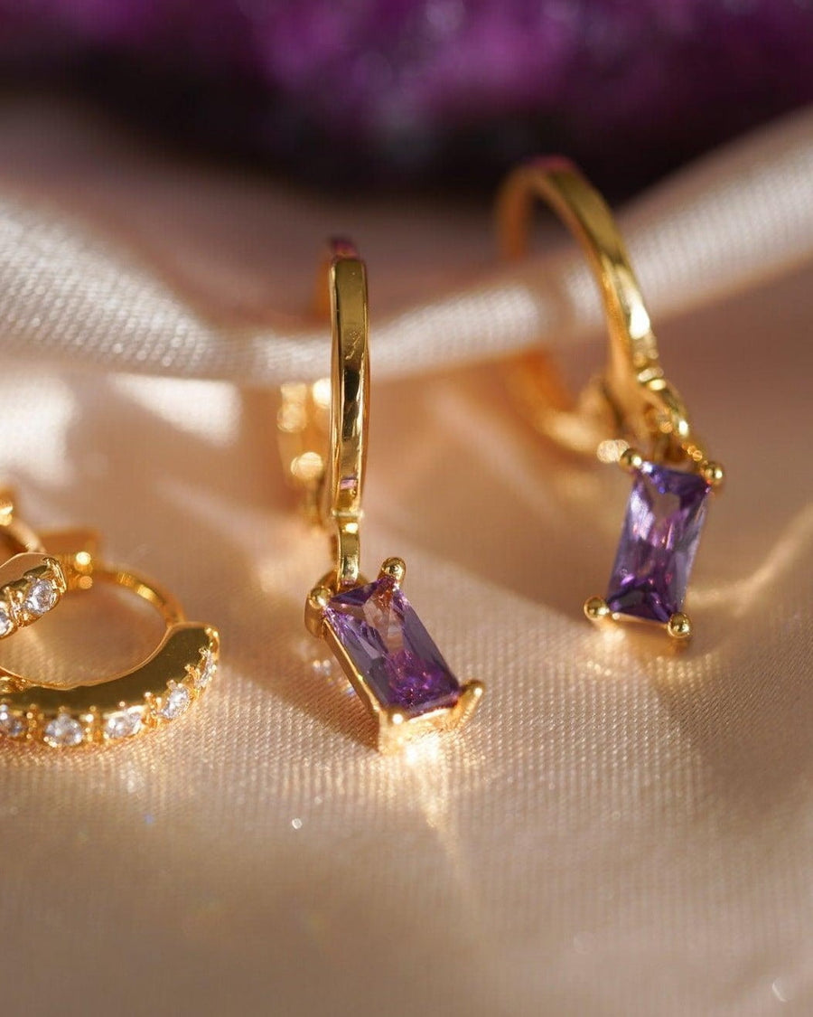 Detail Image - 14K gold plated zircon earrings with violet stones on soft satin fabric