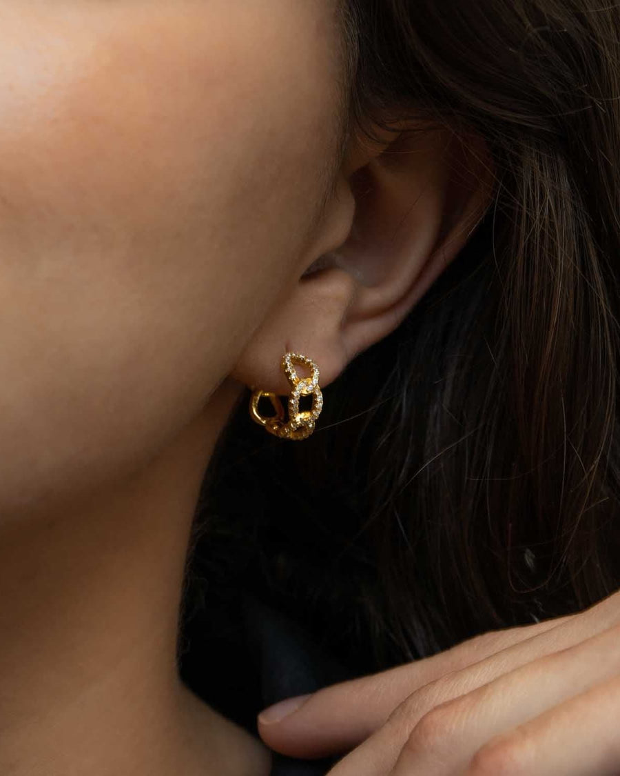 Style Image - 14K gold plated paved curb huggie hoop earring worn on the ear