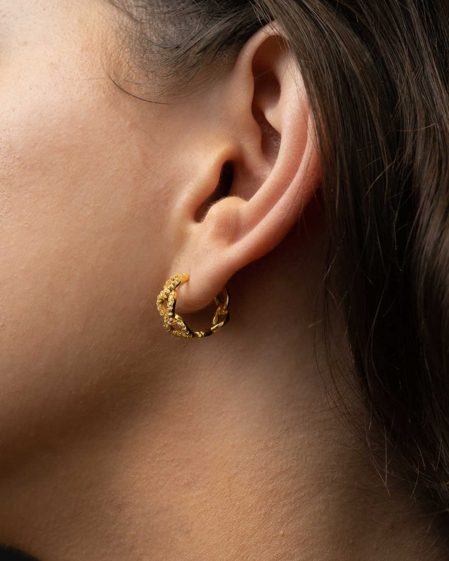 Style Image - Paved Curb Hoop earring worn on the ear, showing the huggie hoop shape and textured curb design