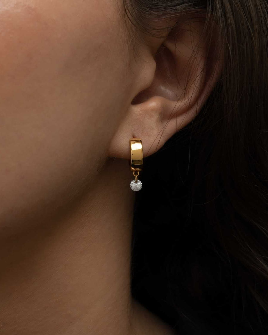 Style Image - Tiny Diamond Hoop earring worn on the ear with a small diamond dangle, 14k gold plated hoop, sold as a pair