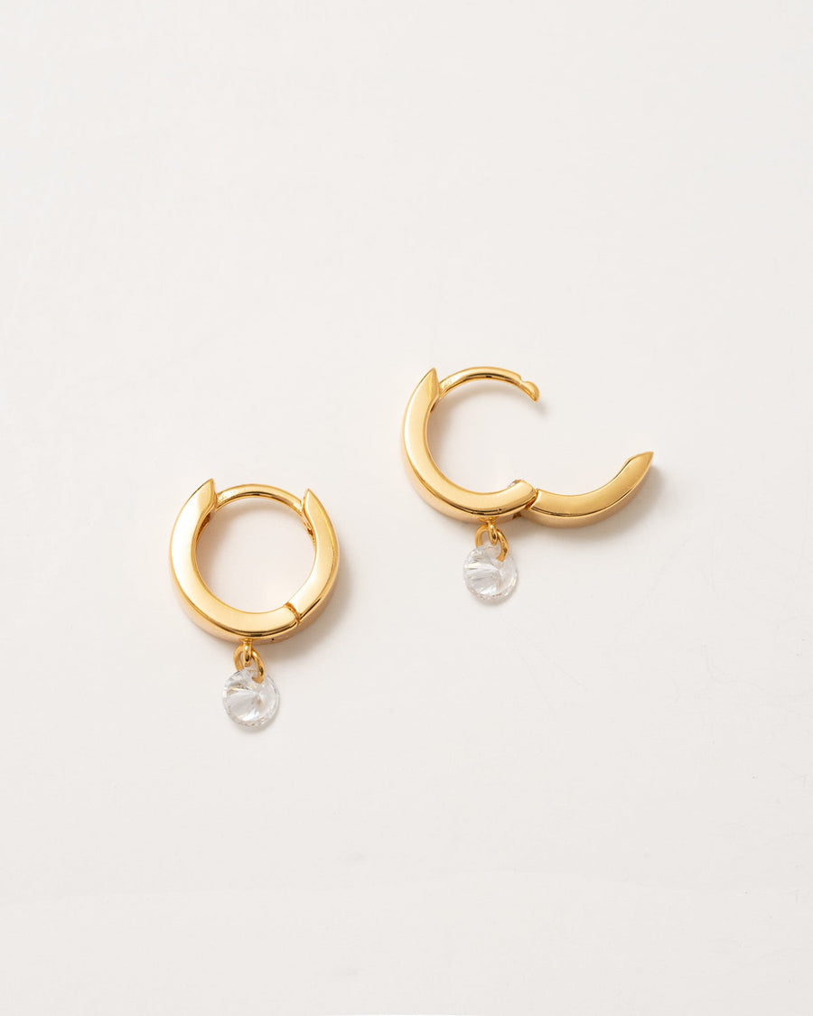 Detail Image - Tiny Diamond Hoops with dangle accents in 14k gold plated design on a light background