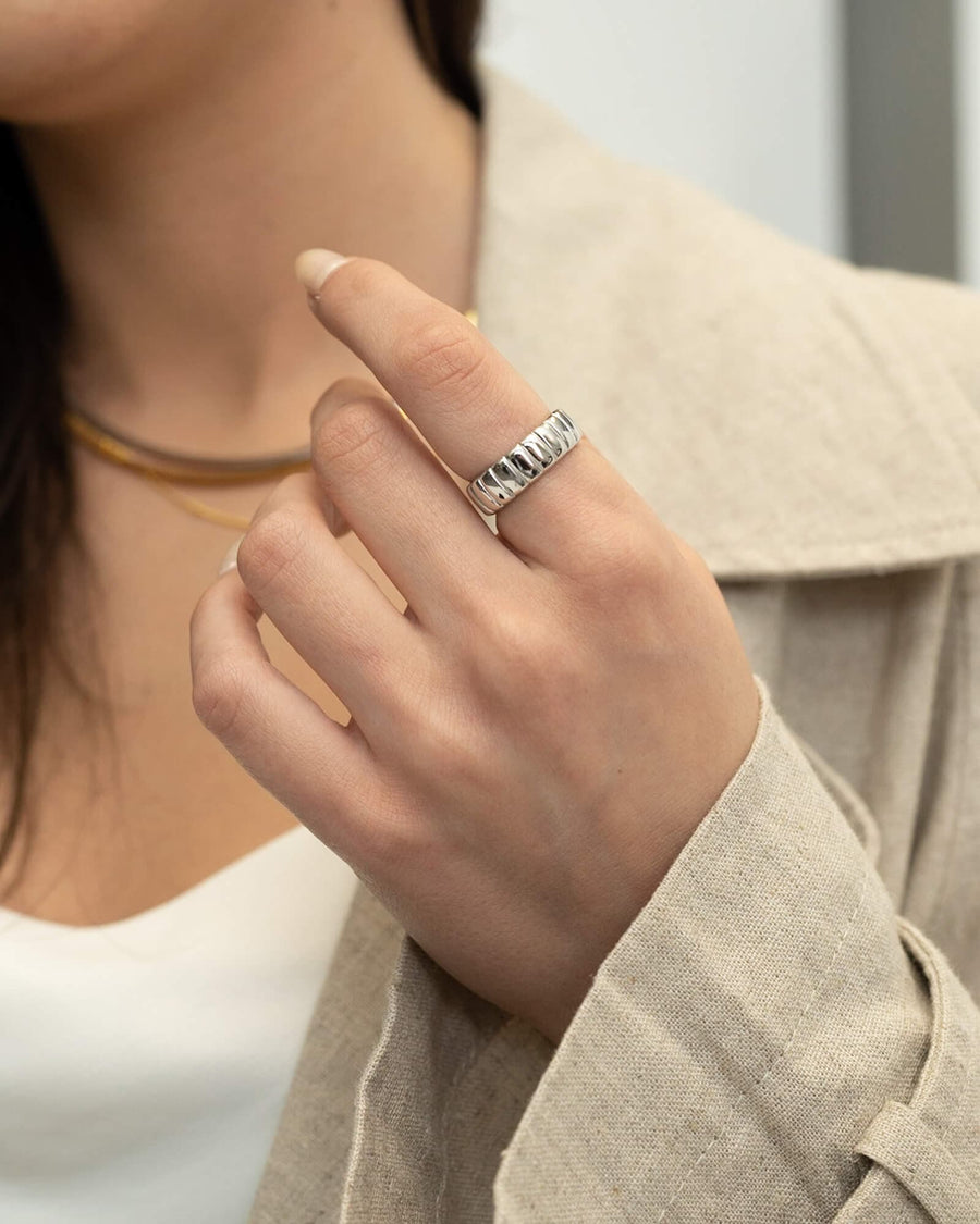 Style Image - Iconic Bold Ring in Sterling Silver worn on the hand with a neutral layered outfit