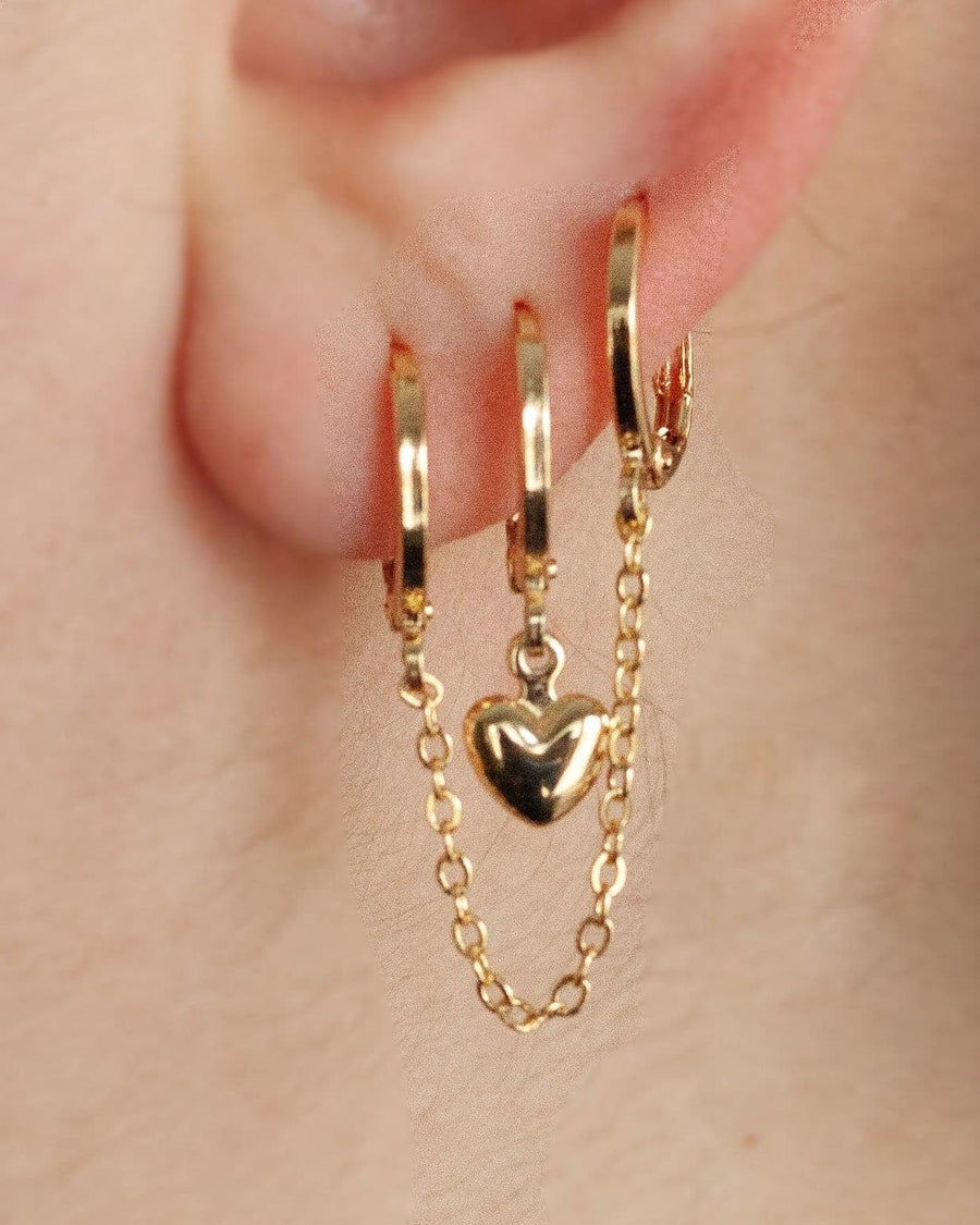 Style Image - Double handcuff earplug holder earrings with linked hoops, chain drape, and heart charm worn on ear
