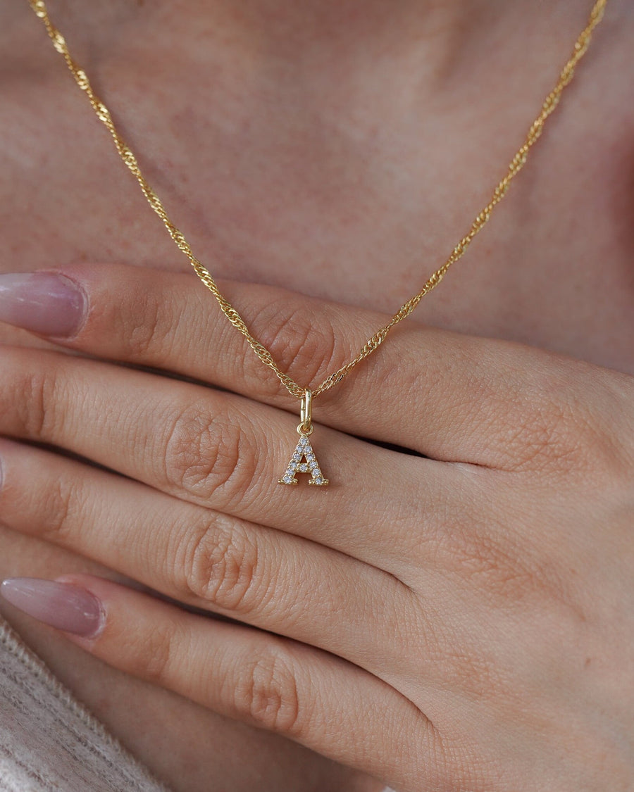 Style Image - 18k gold plated stainless steel diamond letter A charm worn on a gold jewelry chain