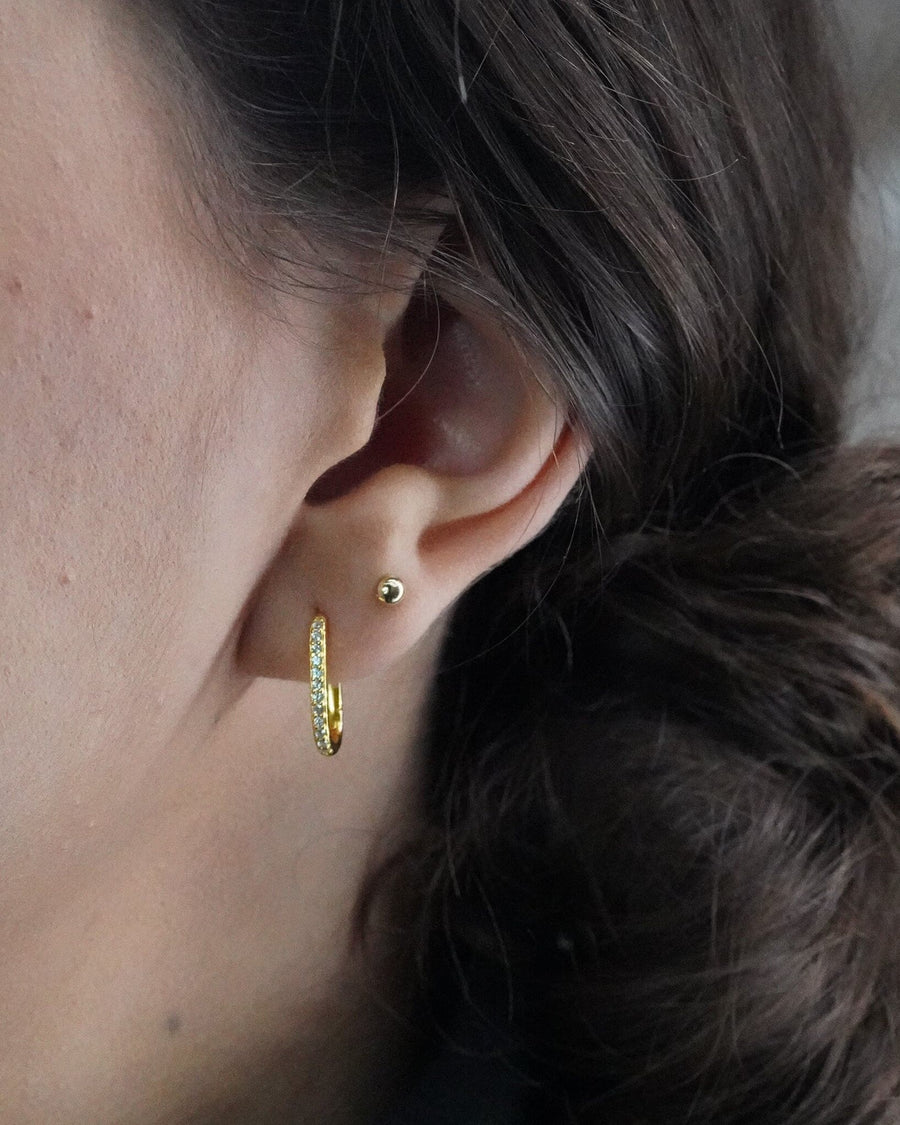 Style Image - Ball stud earring worn on the lobe in a minimal ear stack.