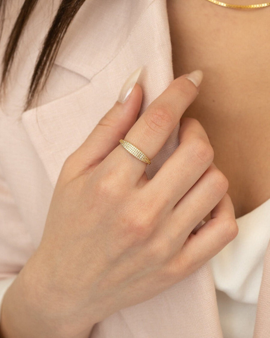 Model Image - Pave Signet Ring with white cubic zirconia on a hand near a pale blazer worn on model