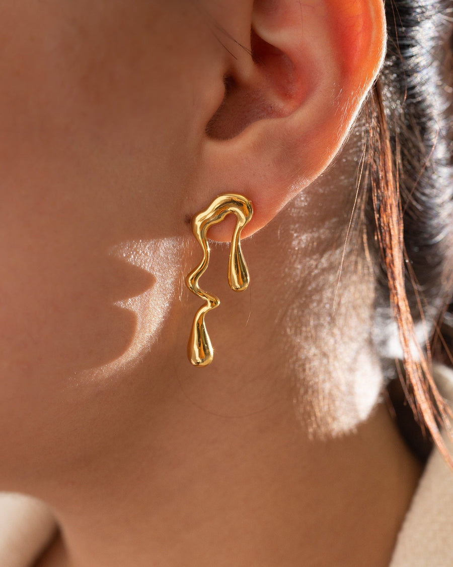 Style Image - Melted Gold Earrings with irregular stud design worn on ear