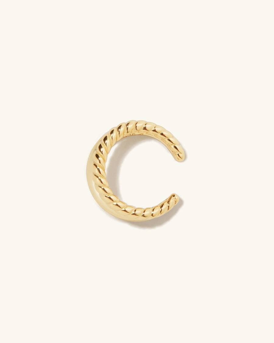 Detail Image - Duo Ear Cuff with twisted double-band design in 14K gold plating on a neutral background