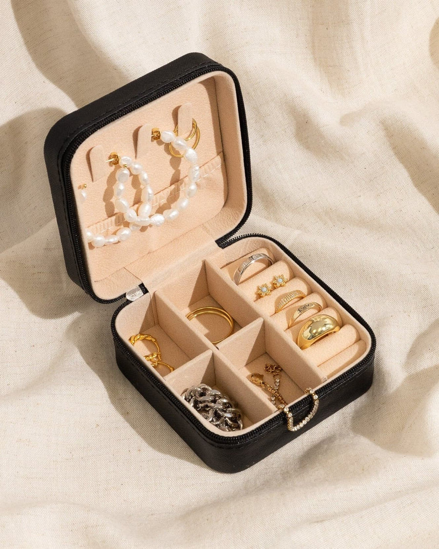 Detail Image - Open black vegan leather jewelry travel case with compartment storage for earrings, necklaces, bracelets, and rings