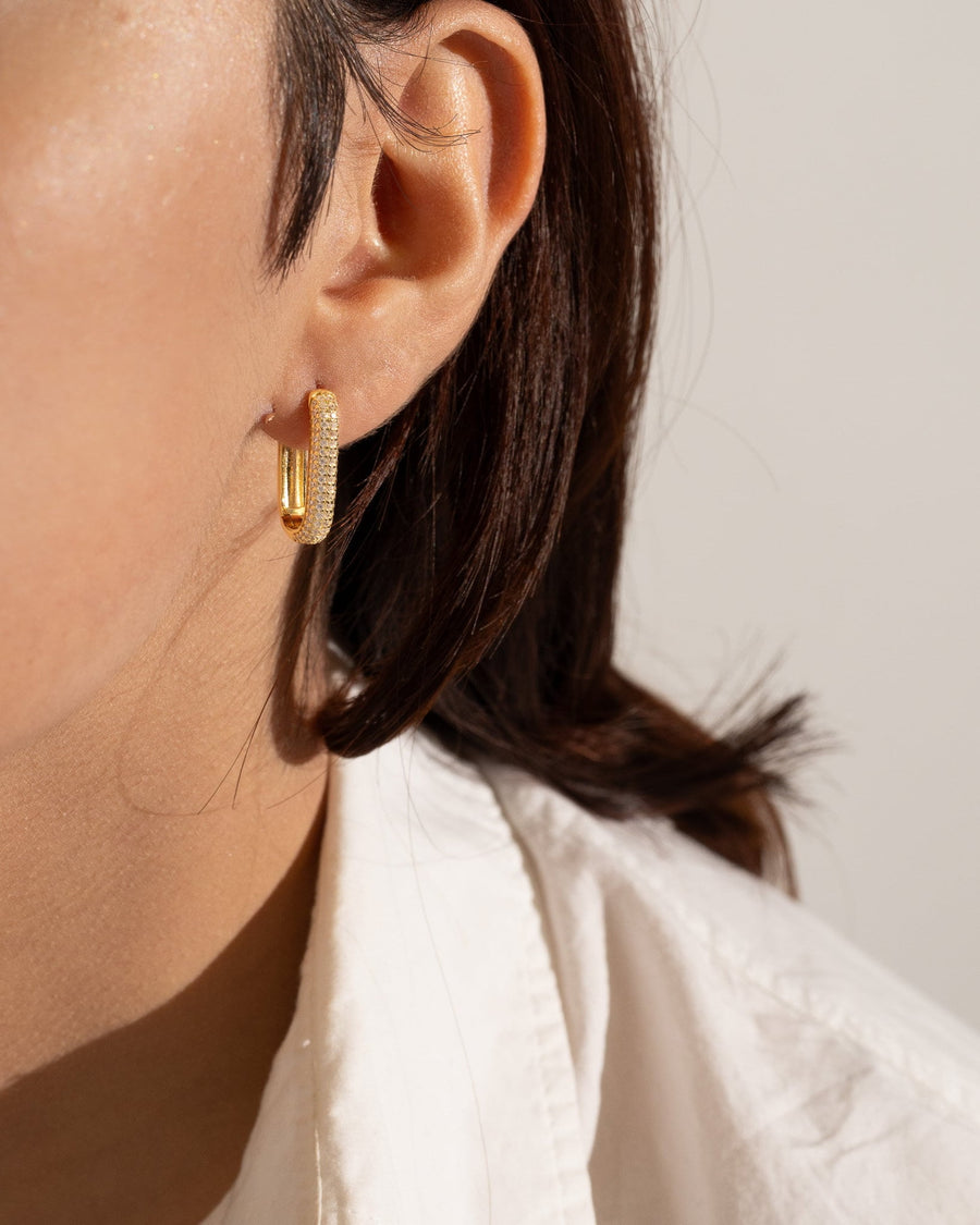 Style Image - Pave Link hoop earring worn on ear with gold plated U link design