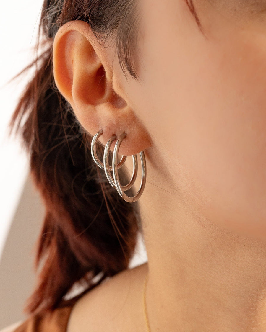 Style Image - Silver-tone hoop earrings worn on ear in multiple sizes