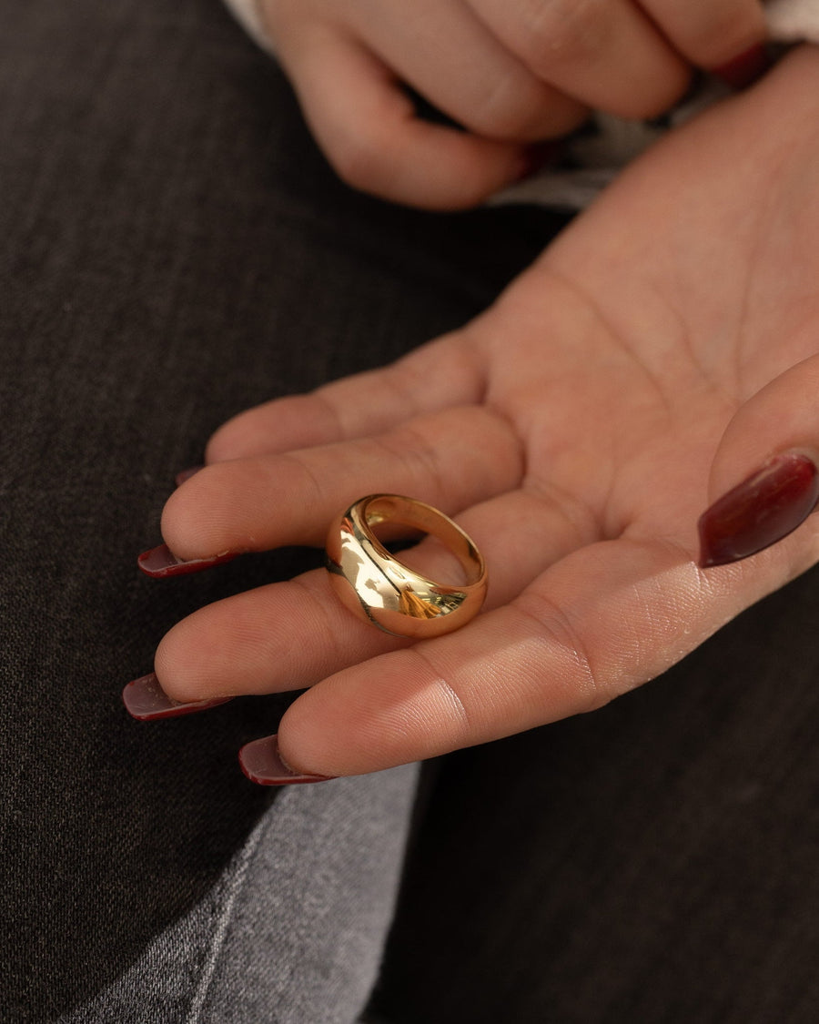 Style Image - 14K gold plated Dome Statement Ring resting in an open hand, highlighting its smooth rounded dome design