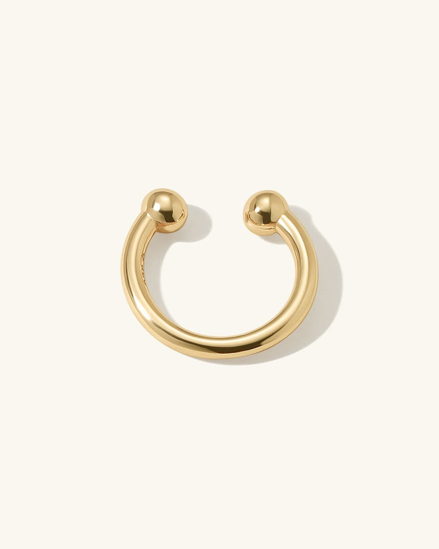 Detail Image - Plain 14K gold plated ear cuff with rounded ends on a neutral background