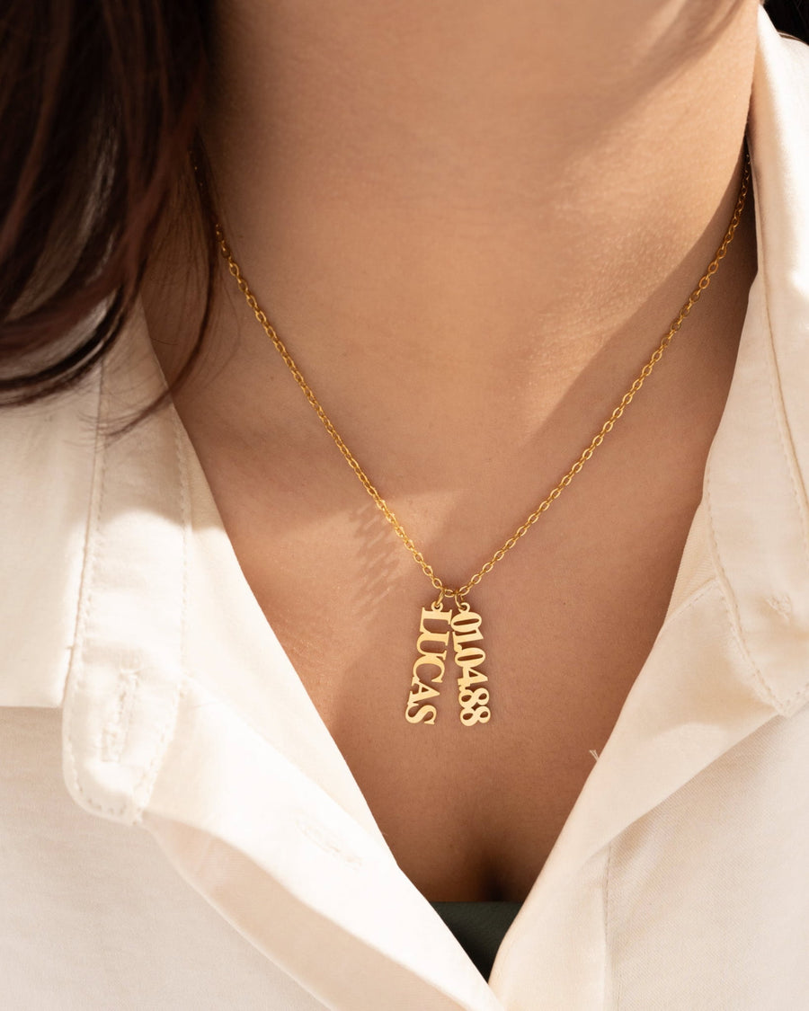 Model Image - 14K gold plated vertical name necklace with two name plates on a model worn on model