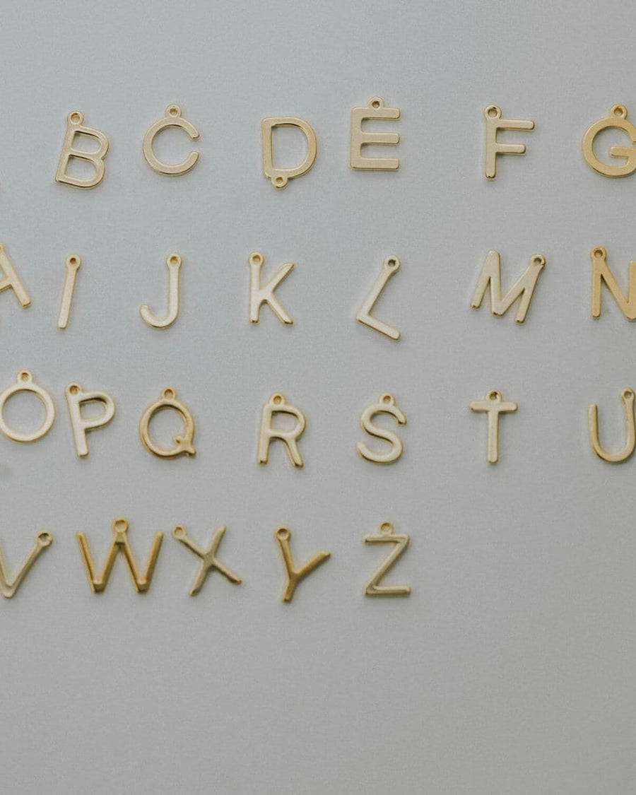 Initial pendants arranged from A to Z for the layering necklace set