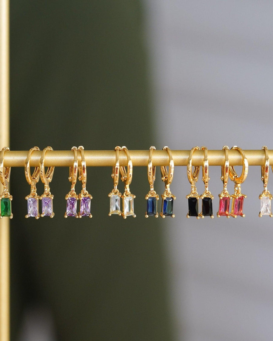 Model Image - 14K gold plated zircon hoop earrings with rectangular dangling stones worn on model