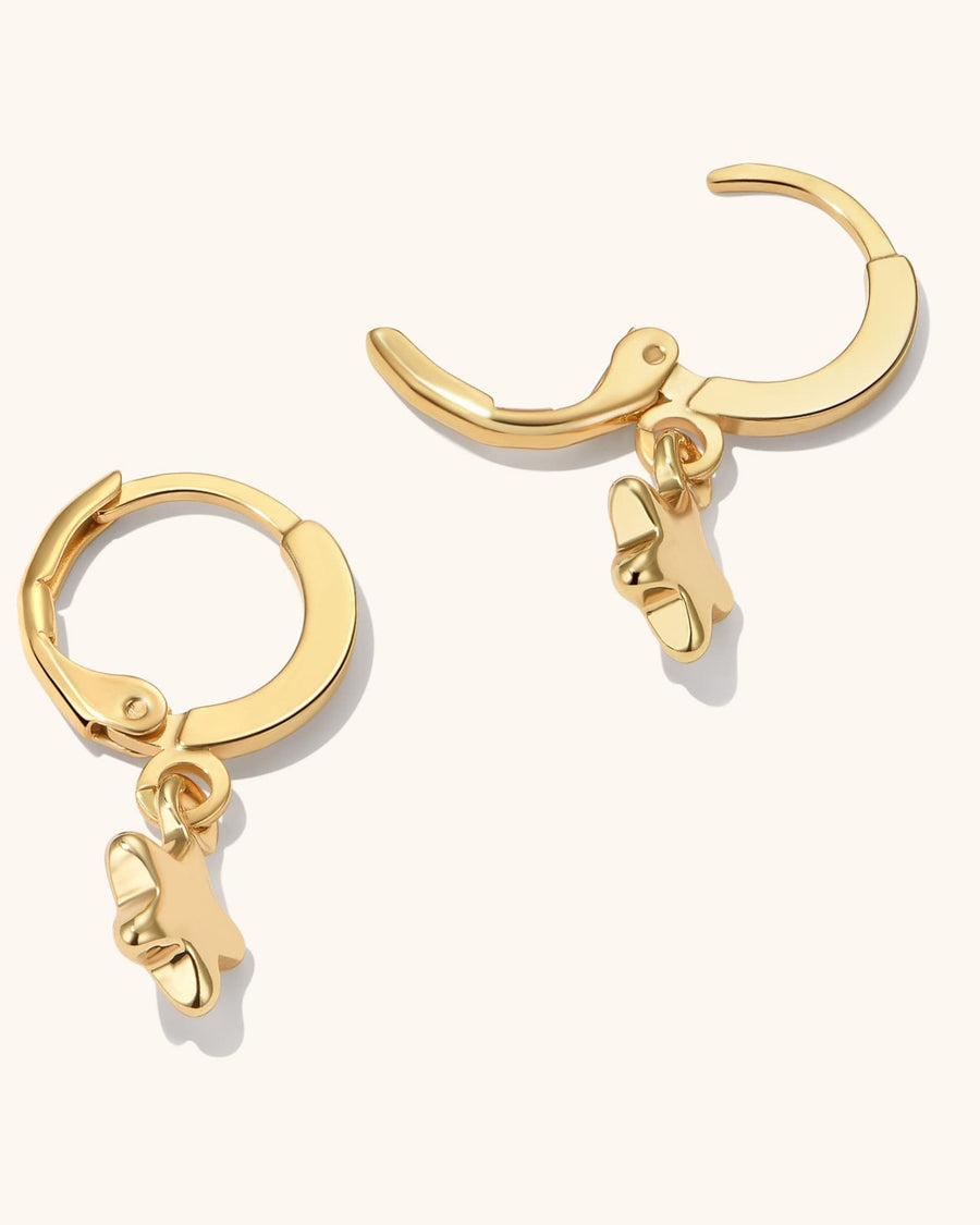 Detail Image - Star earrings with hoop design and dangling star charms in 18k gold plated stainless steel