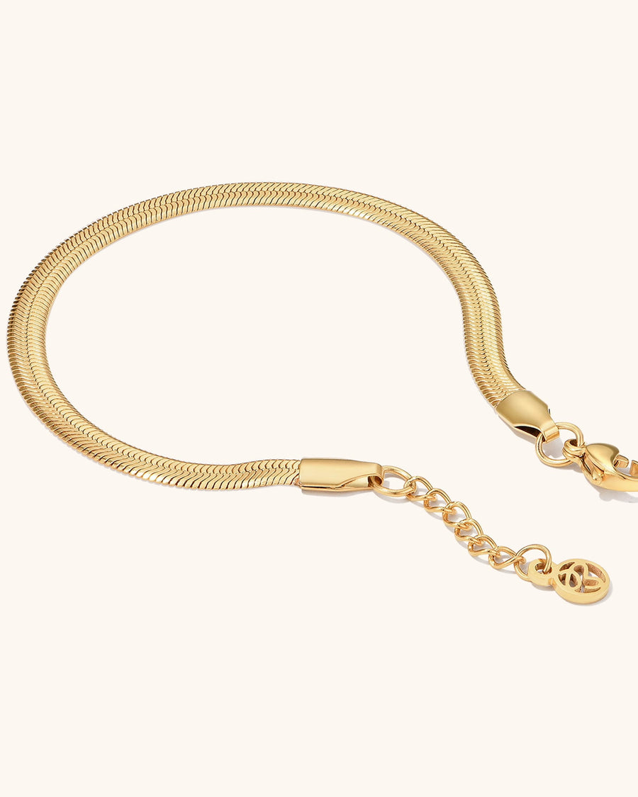Detail Image - Herringbone bracelet with clasp and extender chain in 14k gold plated stainless steel