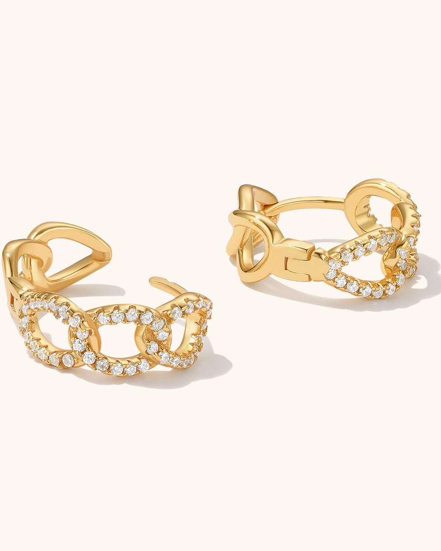 Detail Image - Paved curb huggie hoop earrings in 14K gold plating with pavé-style curb links, shown as a pair