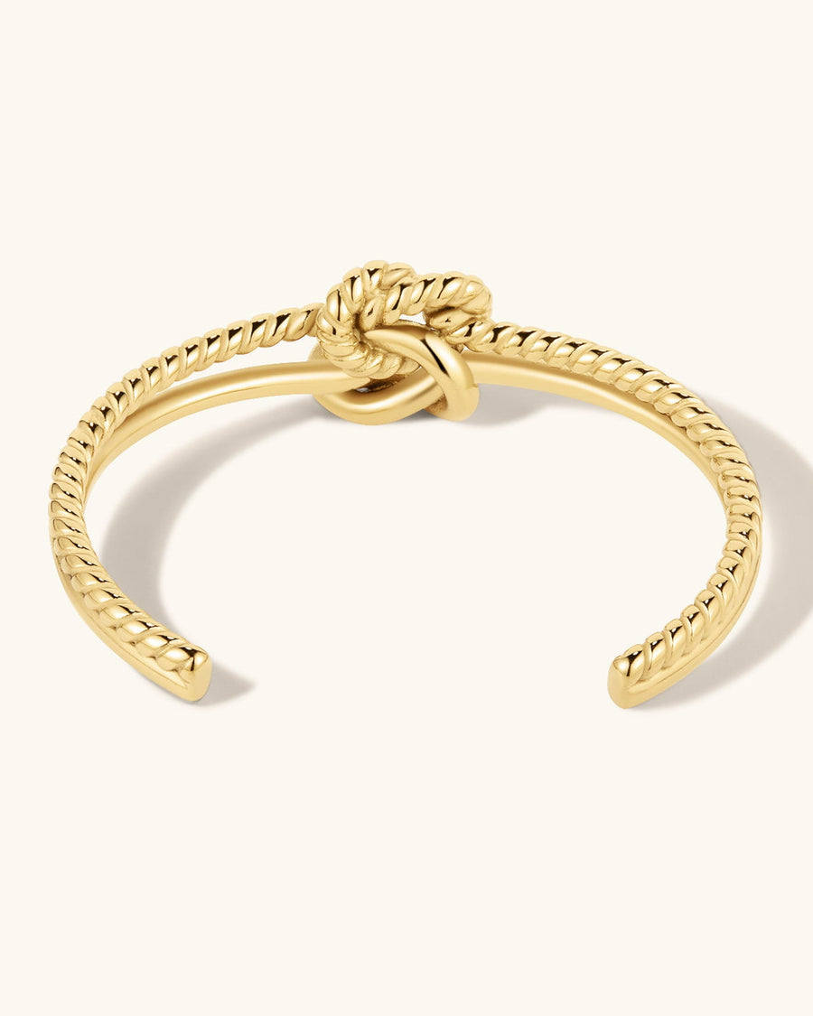 Detail Image - Knot Cuff Bracelet in 18k gold plated stainless steel with twisted texture and central knot design