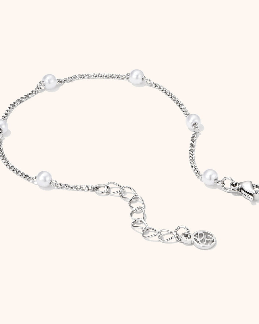 Model Image - silver anklet with delicate pearl beads shown around the ankle worn on model