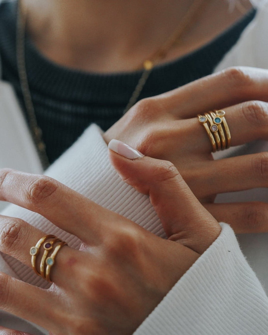 Style Image - Stacked 14k gold plated birthstone rings worn on both hands with minimalist, dainty bands