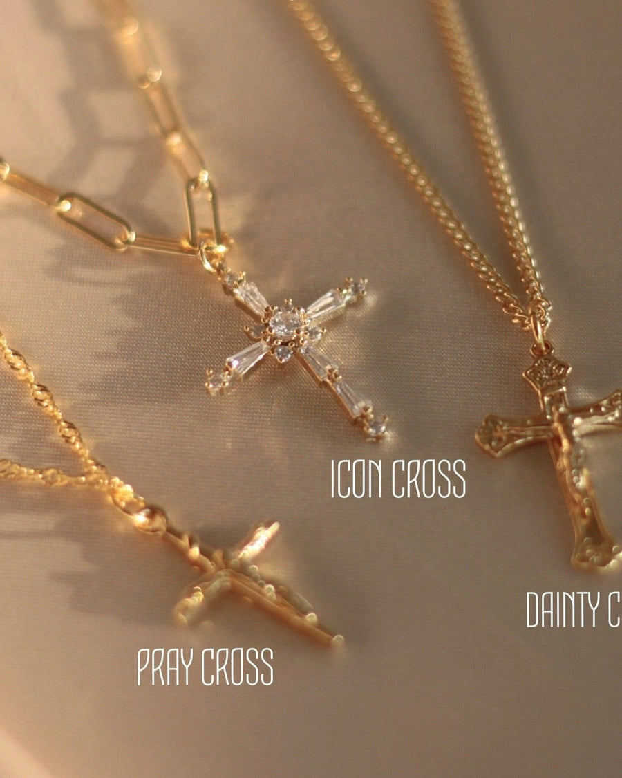 Model Image - Pray Cross necklace with cross pendant layered alongside Icon Cross and Dainty Cross styles worn on model