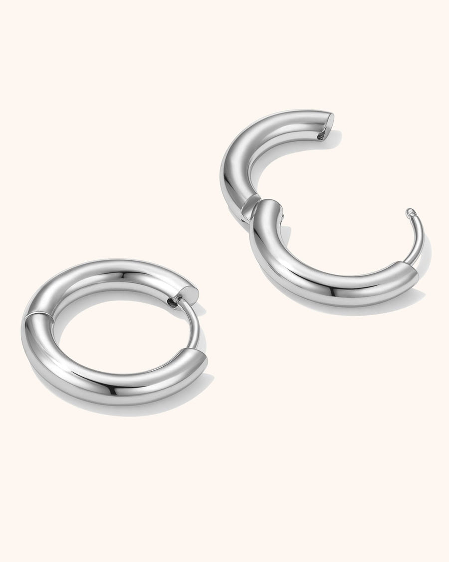 Model Image - Simple 12mm hoop earrings shown at the ear worn on model