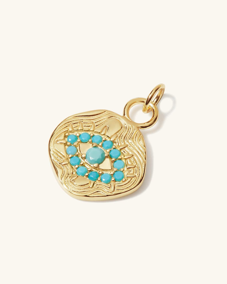 Detail Image - 14K gold plated evil eye charm with turquoise-colored eye design and bail loop on a light background