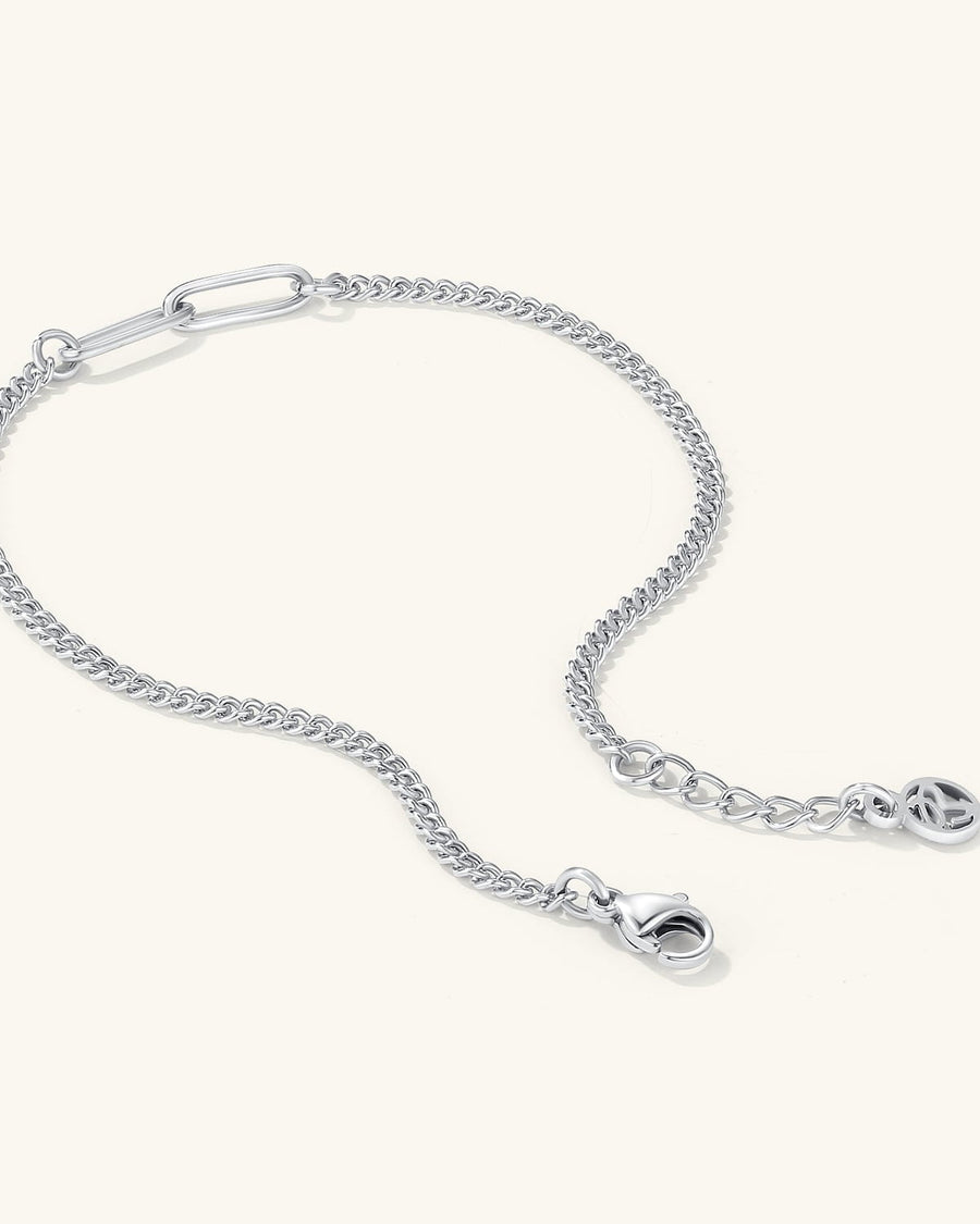 Detail Image - Silver baby curb bracelet with extender chain and clasp on a light background