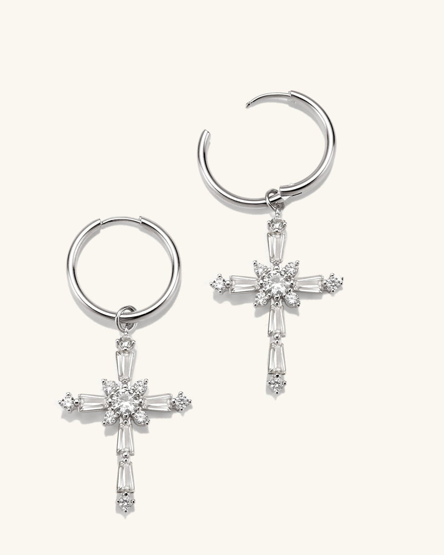Detail Image - Sterling silver cross earrings with CZ accents and circular hoops on a neutral background