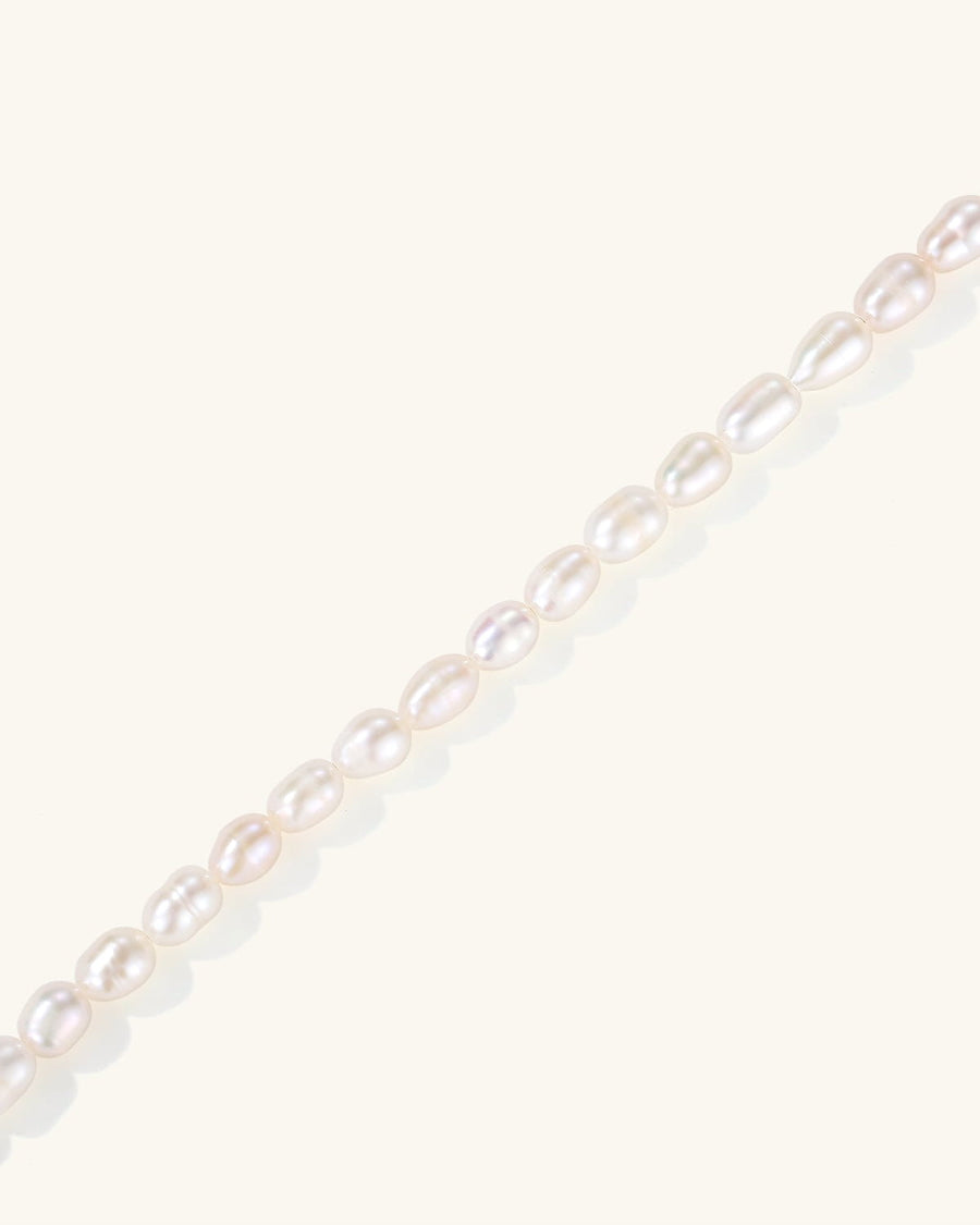 Detail Image - Full Pearl Bracelet with dainty pearl strand detail against a soft neutral background