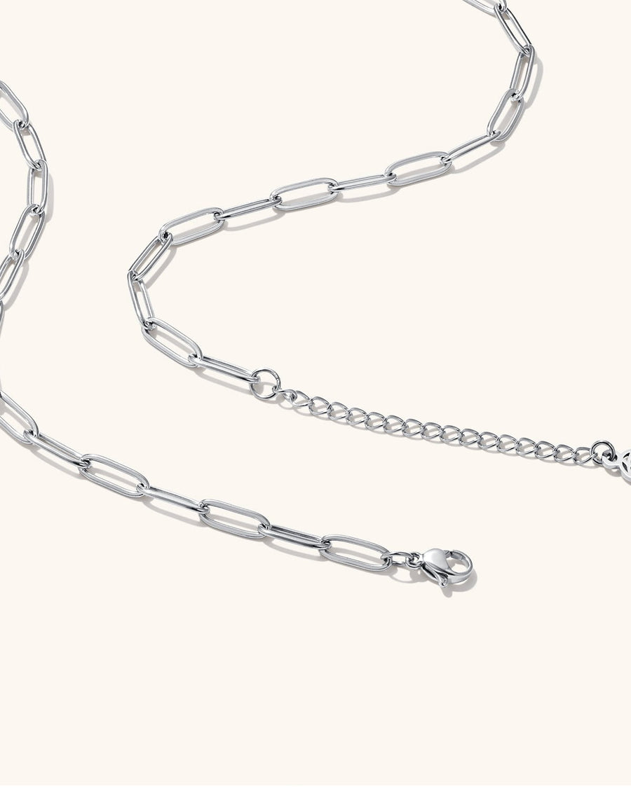 Detail Image - Silver finish paperclip chain with clasp and extender on a light background
