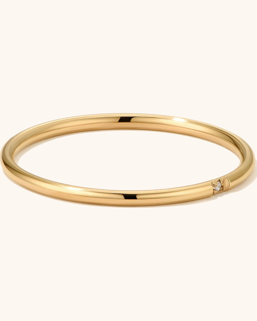 Detail Image - Stackable ring set in 18k gold plated stainless steel with a smooth rounded band and small accent detail