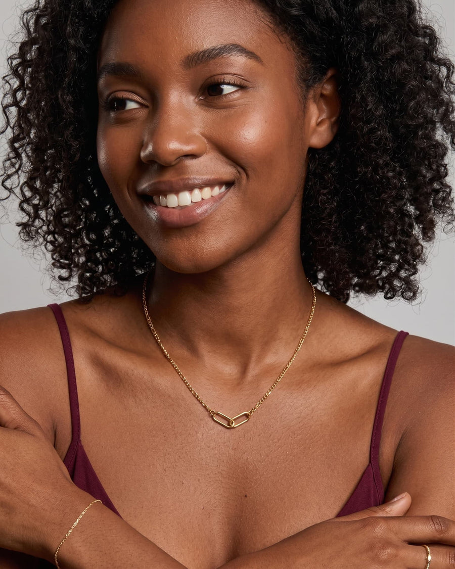 Style Image - Gold plated infinity necklace worn at the collarbone with matching delicate jewelry styling