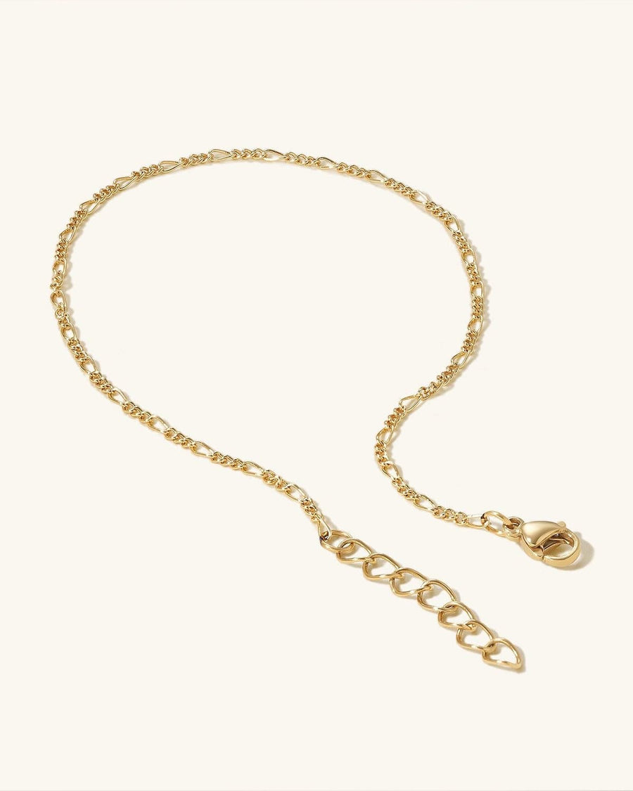 Detail Image - 14K Gold Figaro anklet with 3 mm links, lobster clasp, and extender chain on a light background
