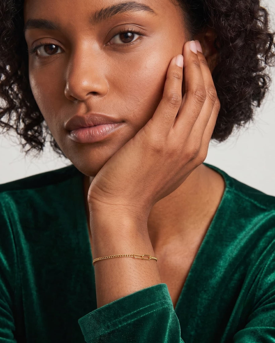 Model Image - 18k Gold Couple Baby Curb Bracelet with sleek baby curb links on the wrist worn on model