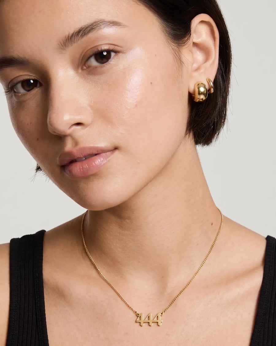 Style Image - 14K gold angel number necklace with 444 pendant worn on a model