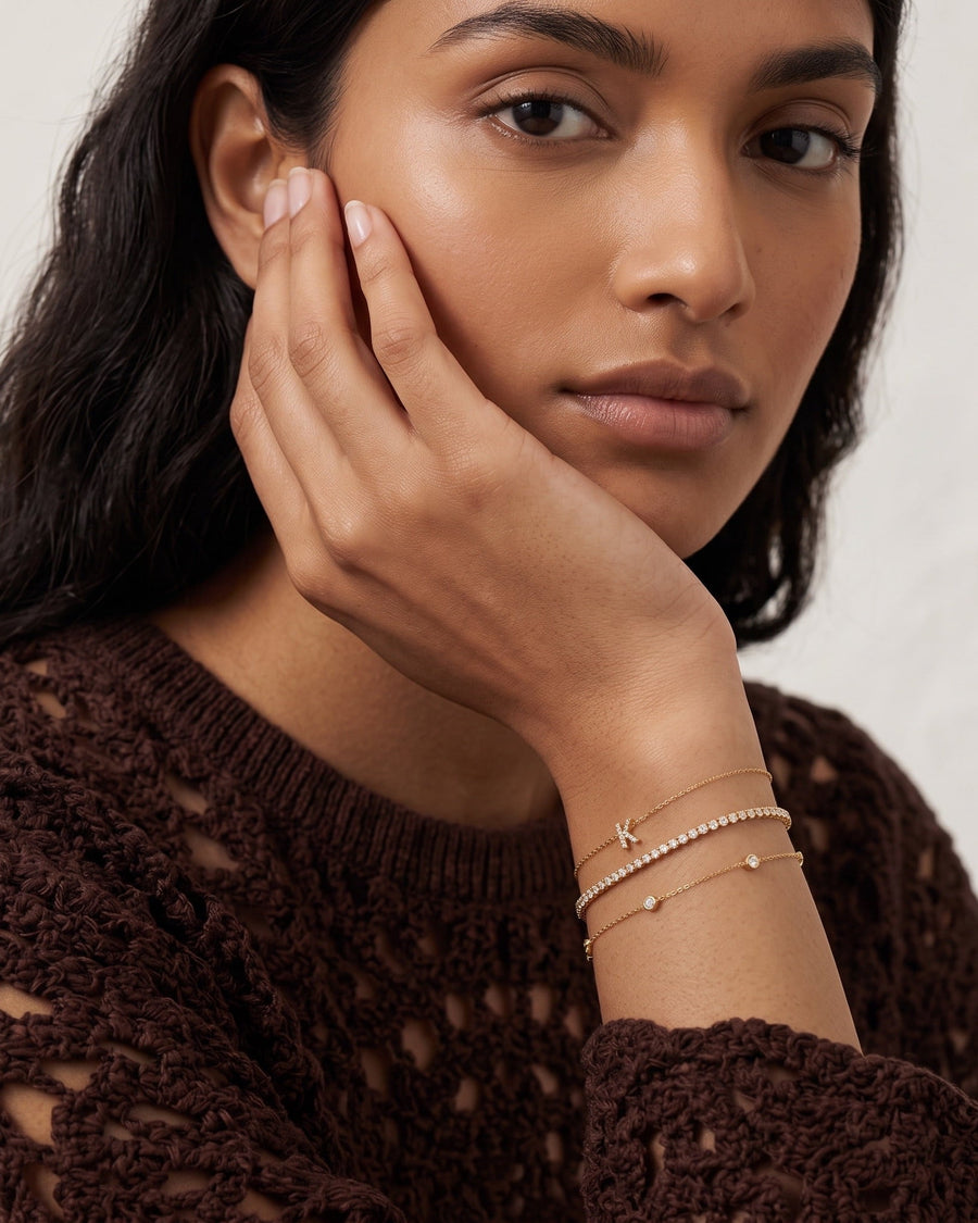 Style Image - 14k solid gold pave diamond initial bracelet styled in a delicate stack on the wrist