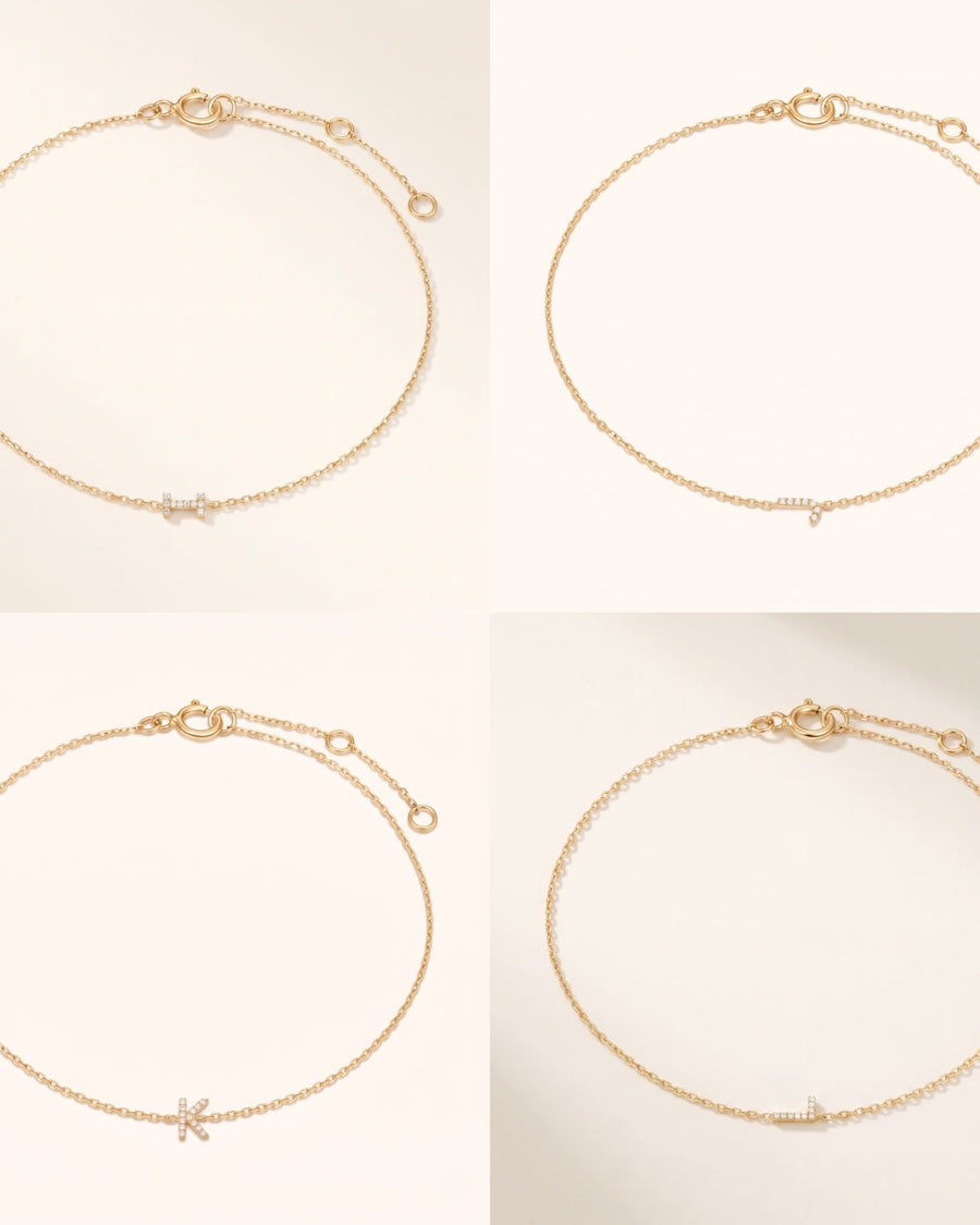 Detail Image - 14k solid gold pave diamond initial bracelets with delicate cable chains and extender clasps, shown in multiple letter options